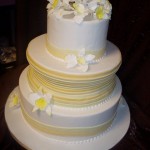 Yellow and White Wedding Cake with Sugar Orchids