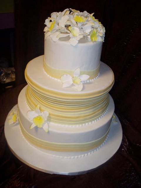 Yellow and White Wedding Cake with Sugar Orchids