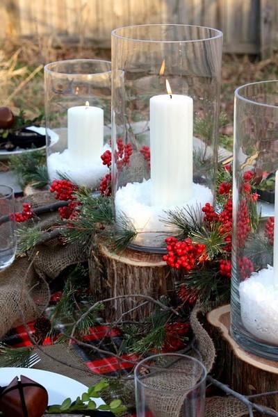 rustic winter wedding decor with candles, snow and evergreens rustic winter decor Winter Wedding Decor From Rustic to Bling